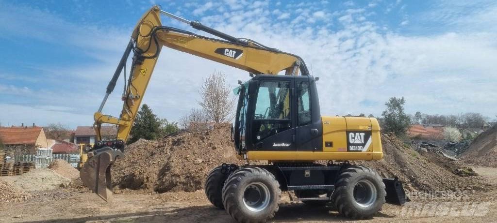 CAT M 313 D Escavadoras de rodas