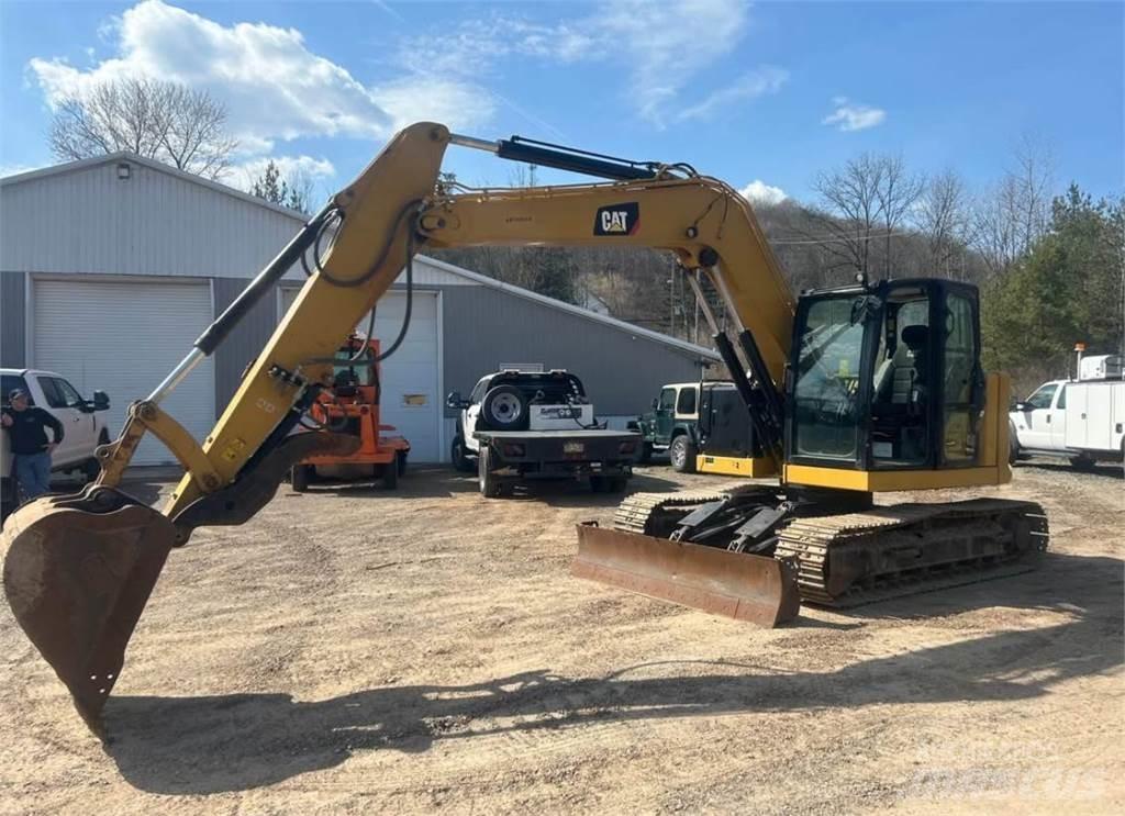 CAT 310 Miniescavadeiras